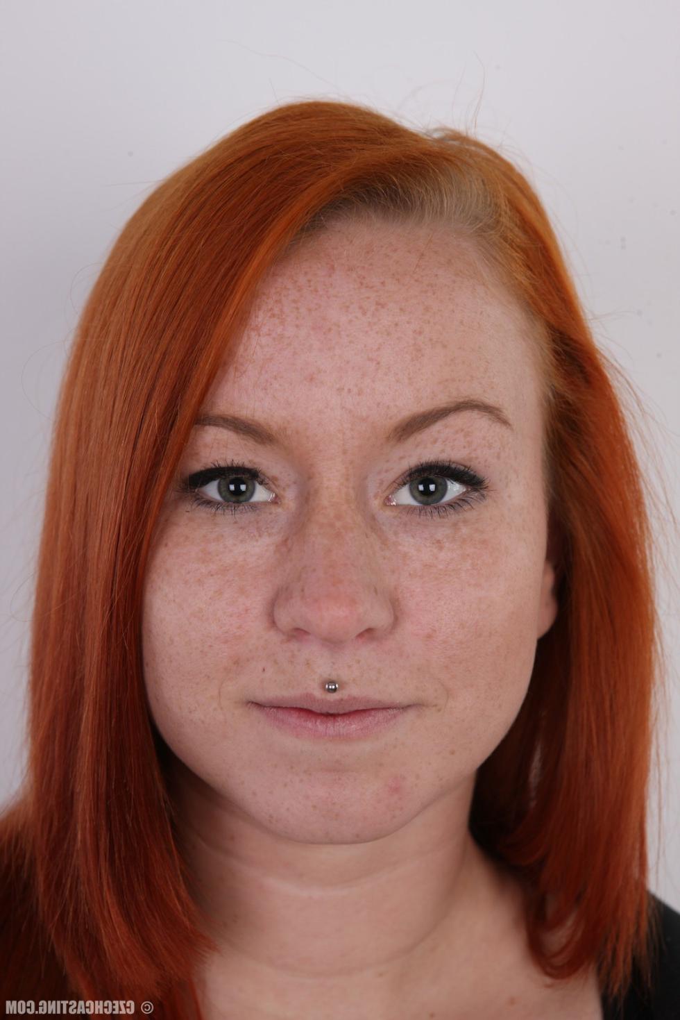 15P Busty redhead posing in these casting pics