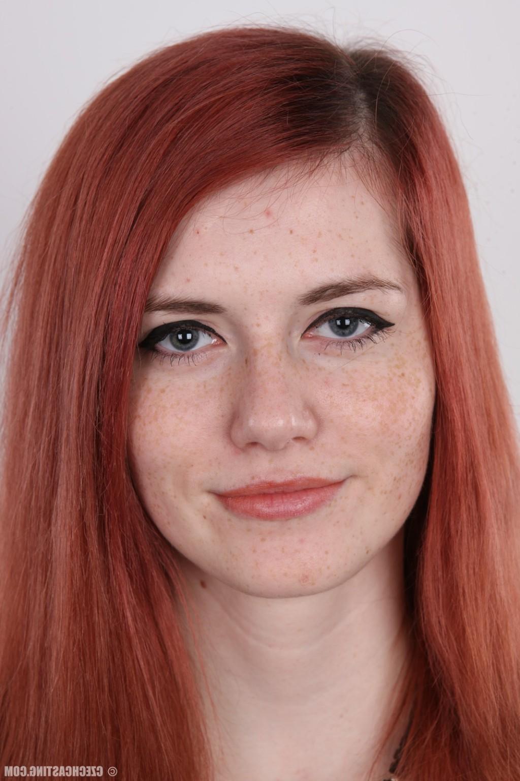 17P Petite redhead teen poses