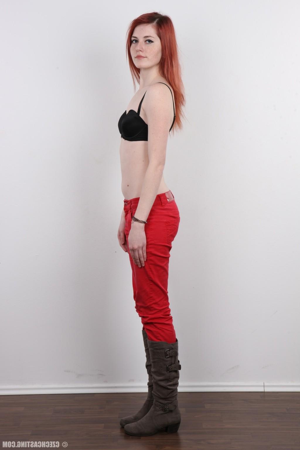 17P Petite redhead teen poses