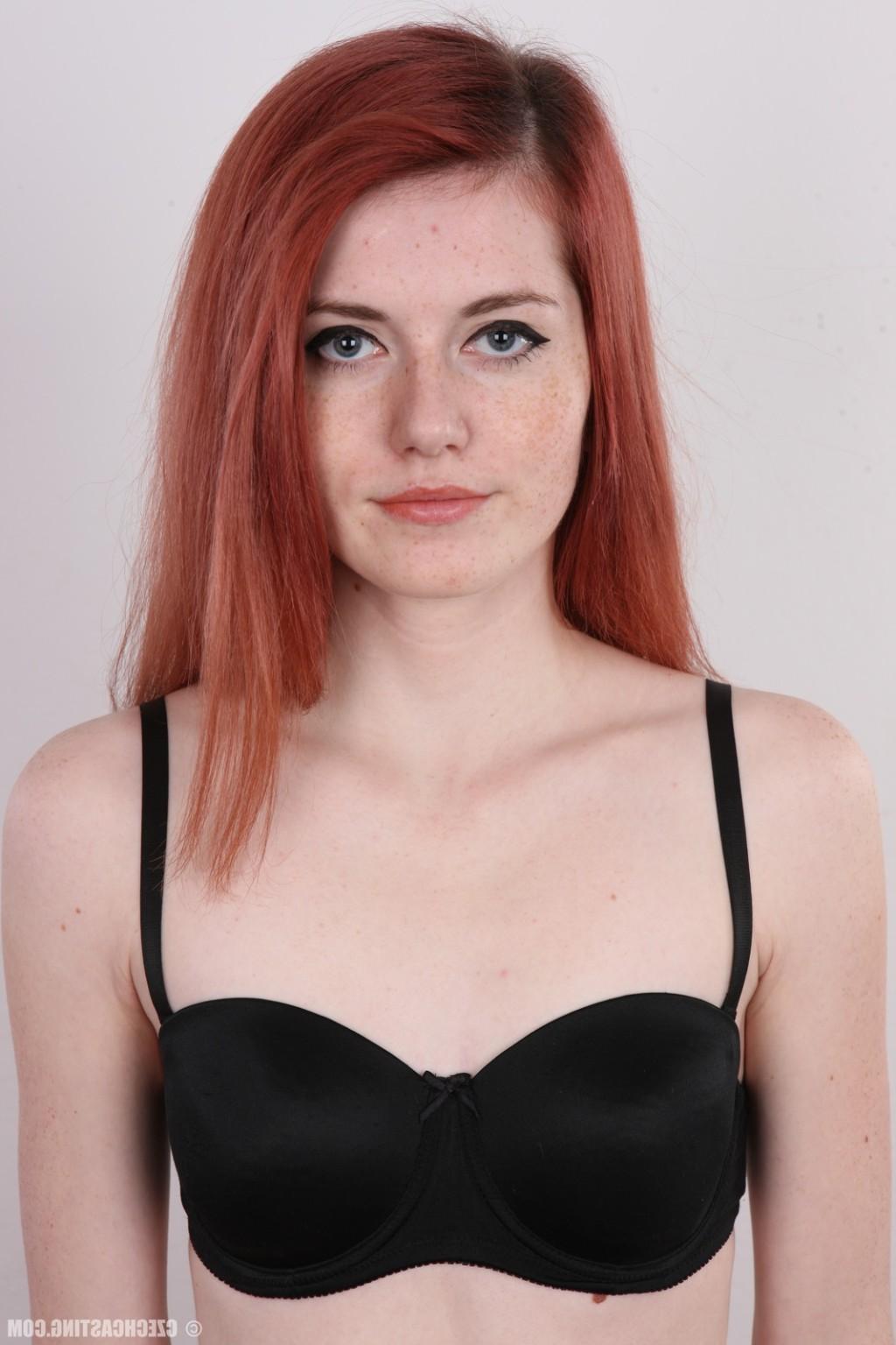 17P Petite redhead teen poses