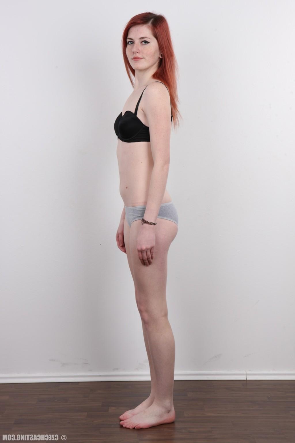 17P Petite redhead teen poses