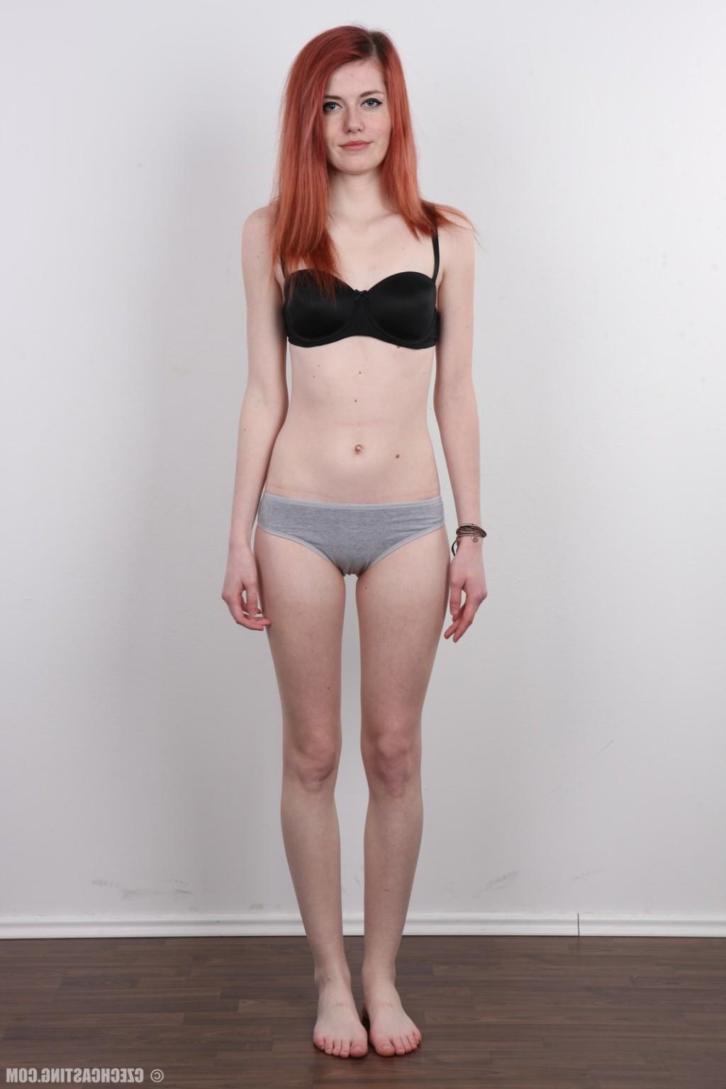17P Petite redhead teen poses