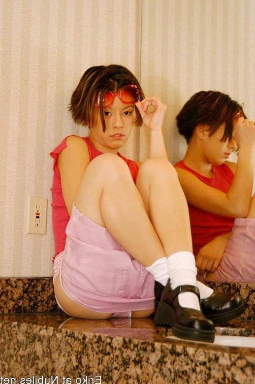 14P Tiny tits teen eriko inserts dildo up her snatch
