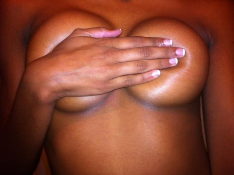 14P Horny black chick flaunts her fine breasts and bald pussy in hot