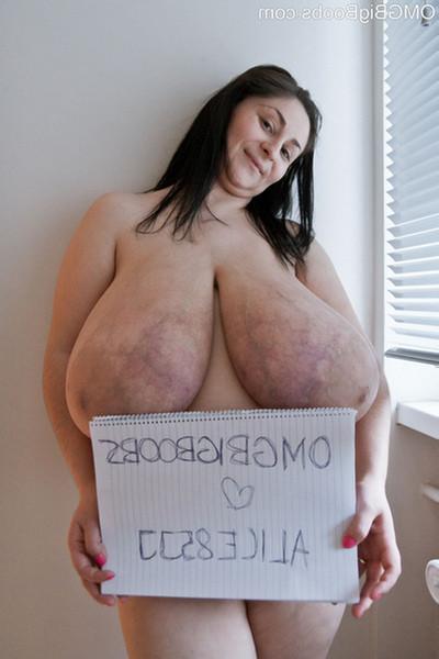 15P Amateur babe shows off off huge all natural 85JJ tits