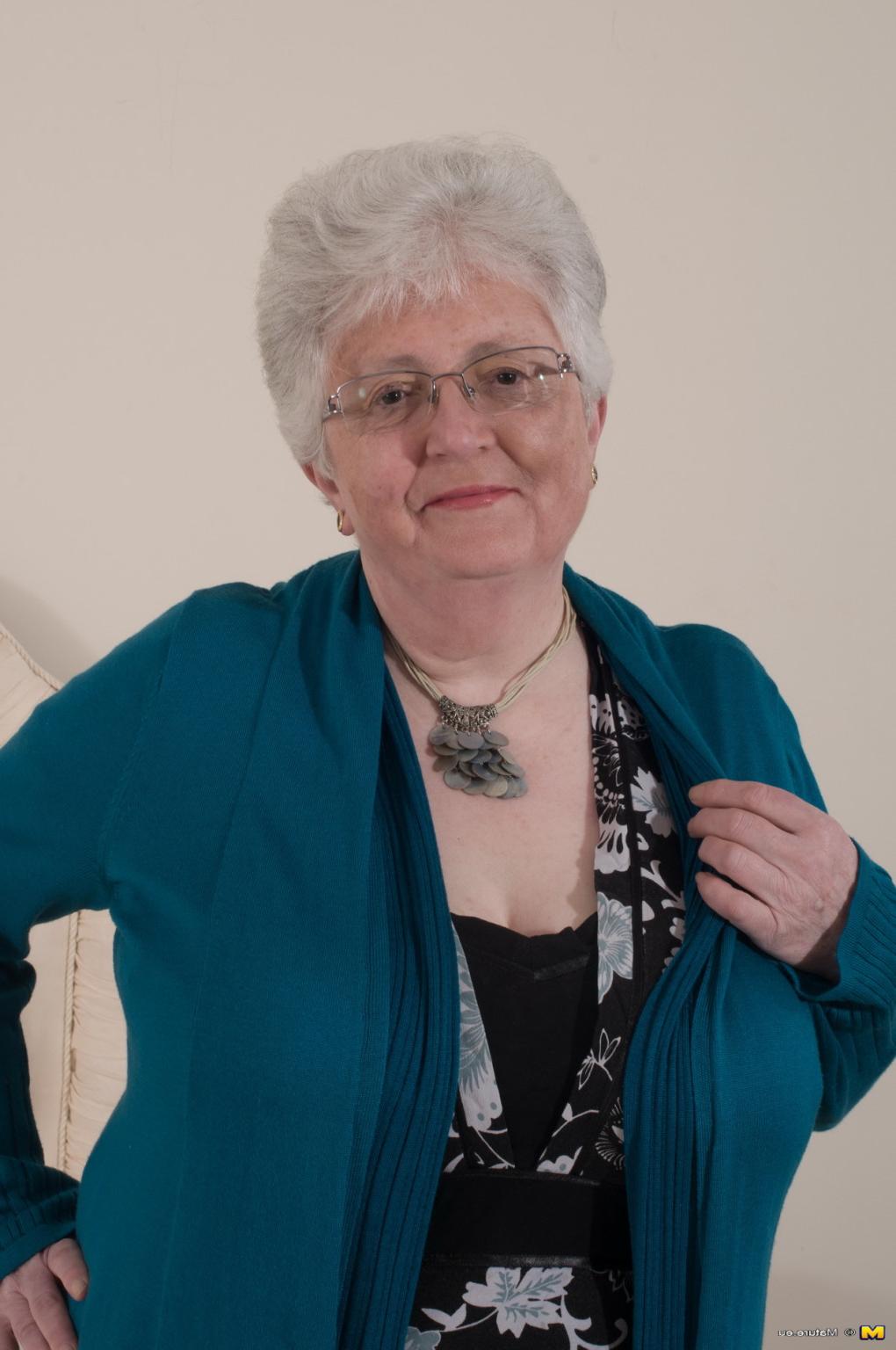 12P Naughty Big breasted British granny getting frisky