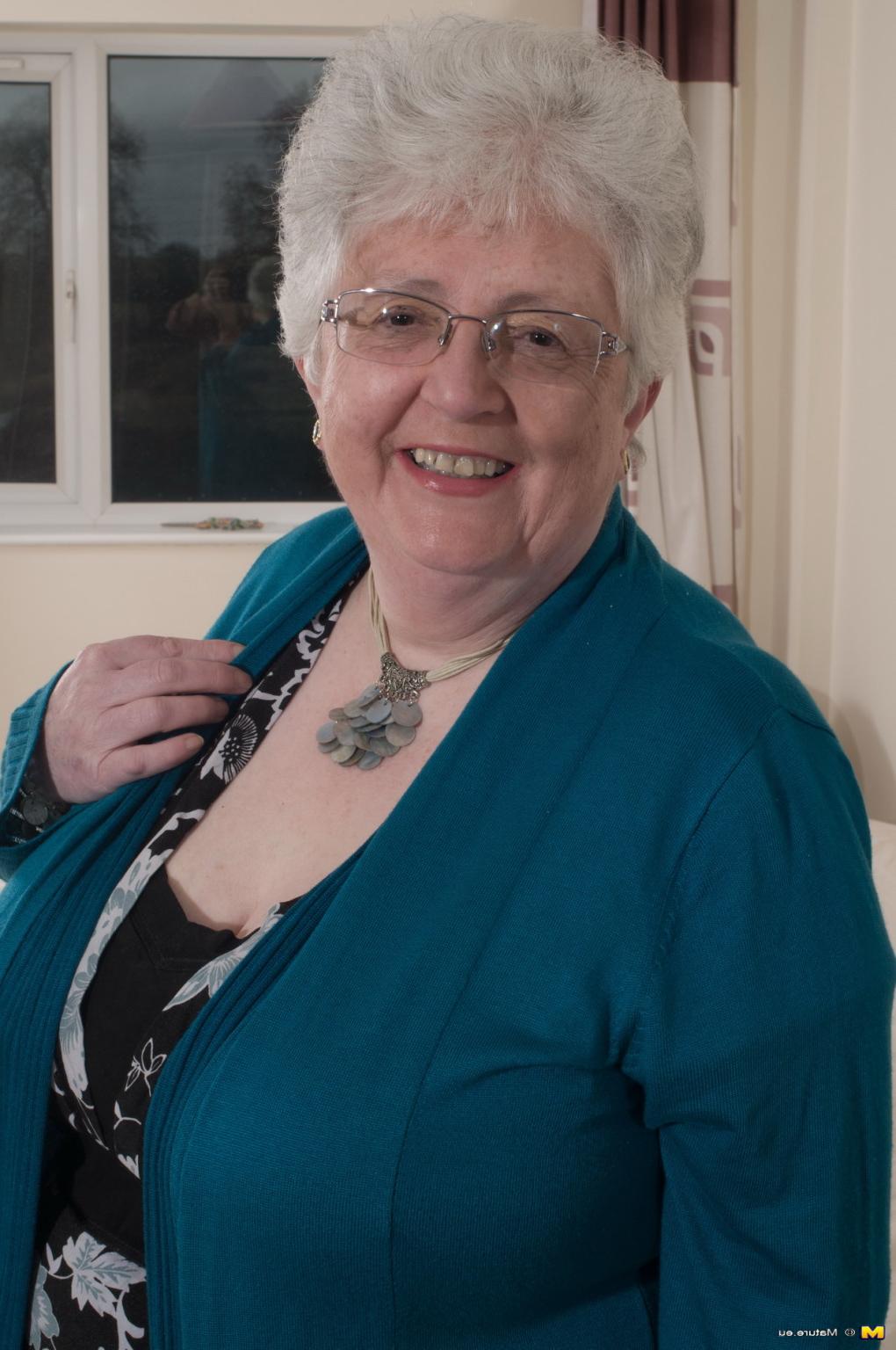 12P Naughty Big breasted British granny getting frisky