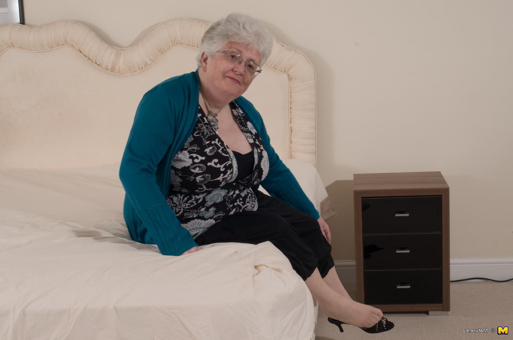 12P Naughty Big breasted British granny getting frisky