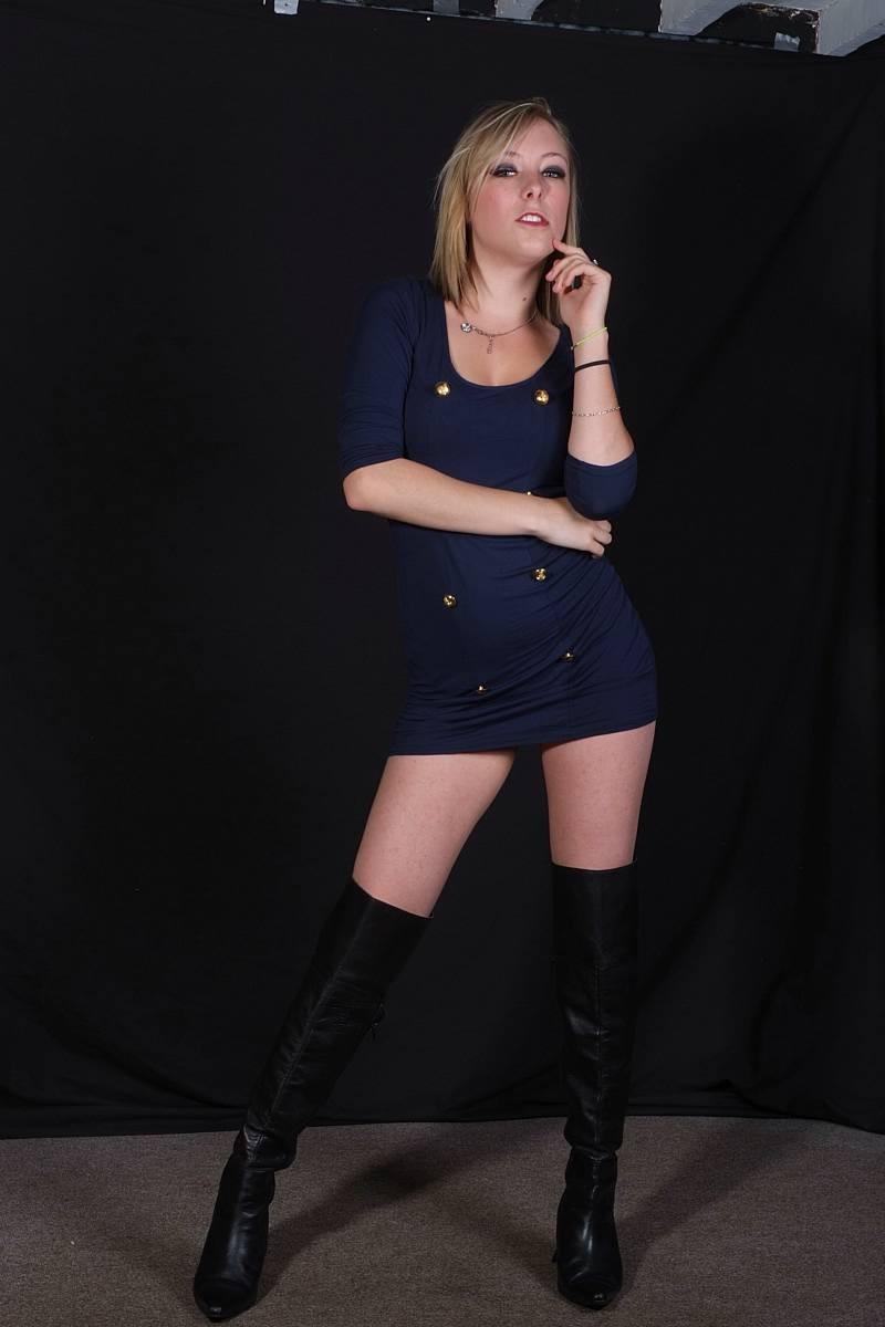 15P Sexy blonde shows off in a miniskirt and leather boots