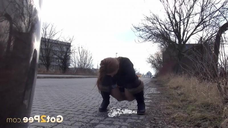 15P Pretty redhead is caught twice pissing in public