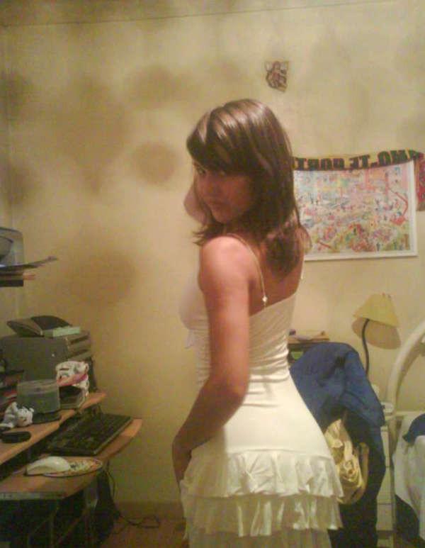 10P Pictures of a pretty teen displaying her perky breasts