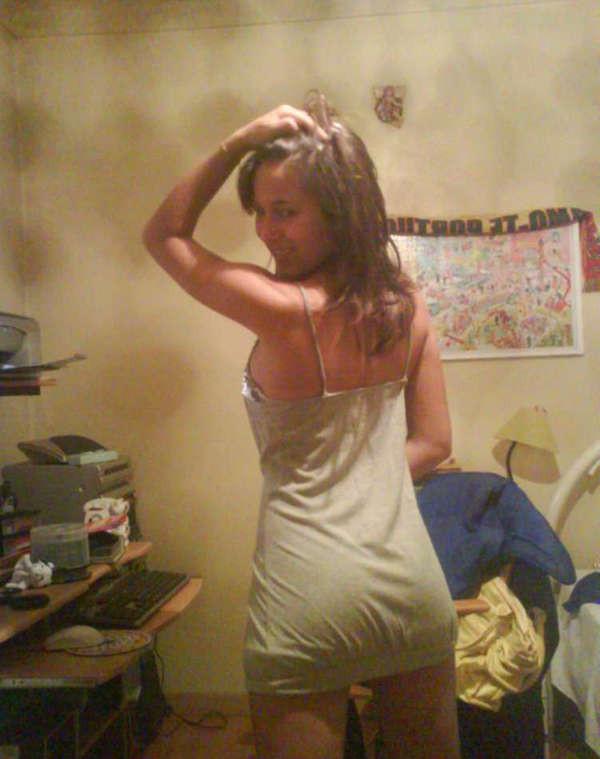 10P Pictures of a pretty teen displaying her perky breasts