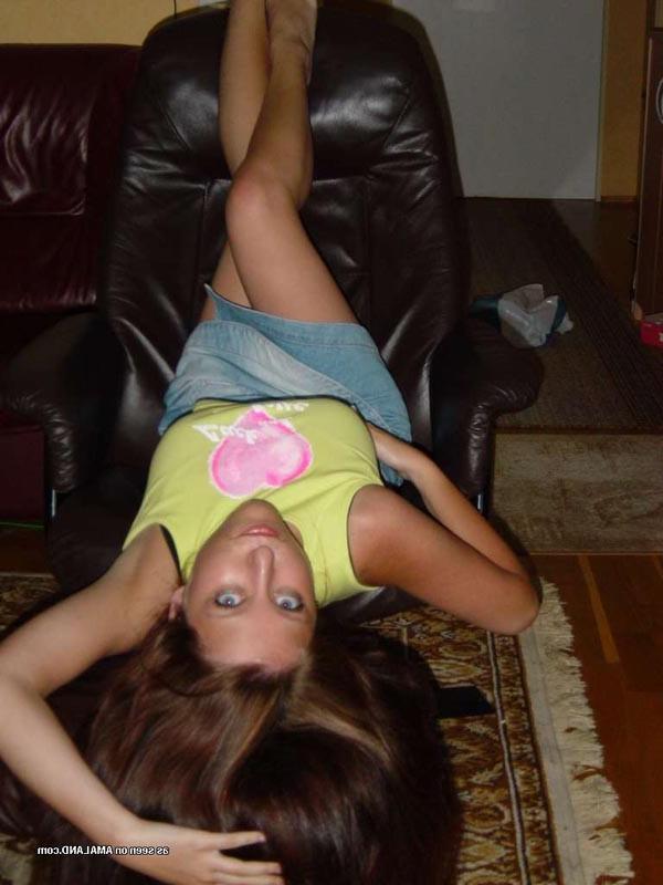 15P Sexy brunette cutie wearing a mini skirt posing in the garden