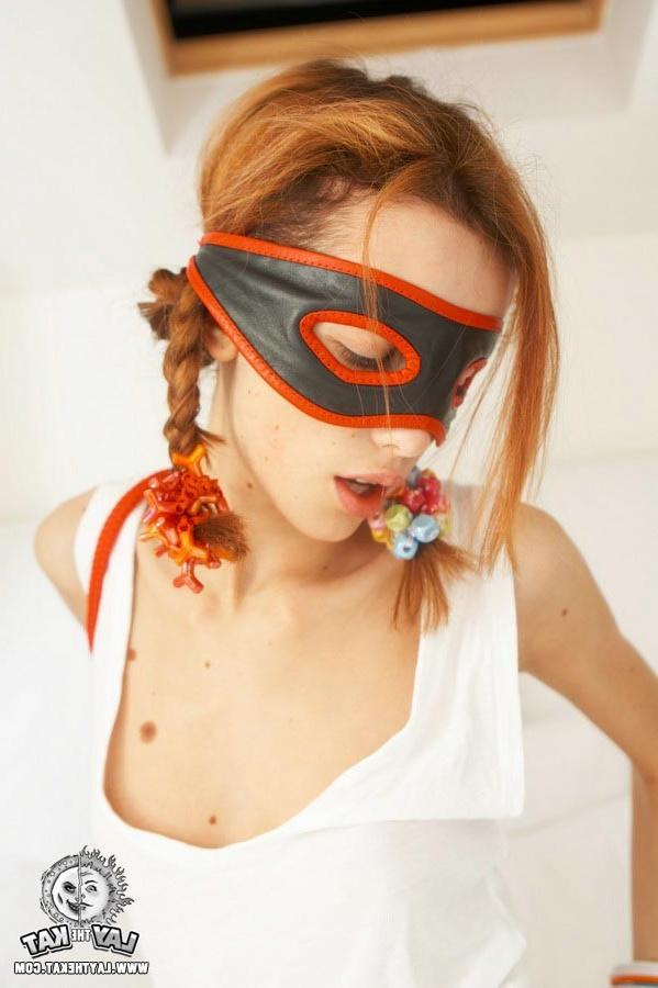 15P Young teen girl wearing a black mask