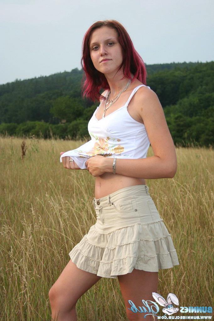 20P Cute redhead girl in the grass