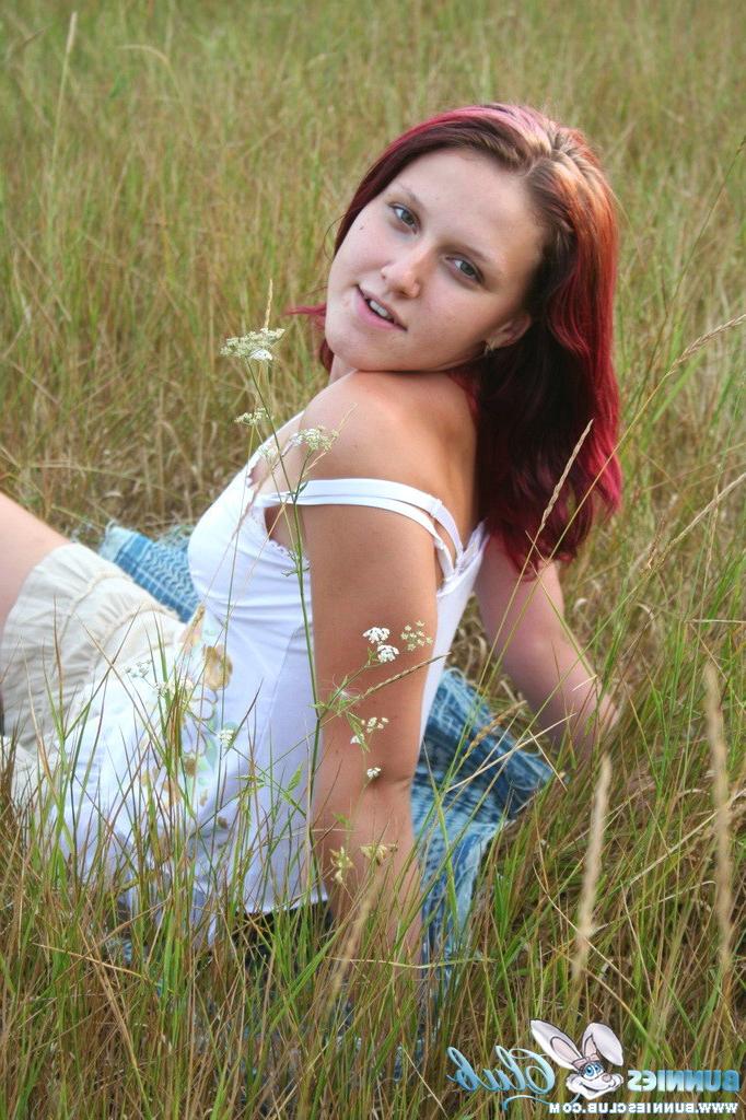20P Cute redhead girl in the grass