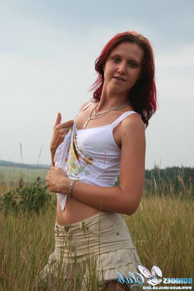 20P Cute redhead girl in the grass