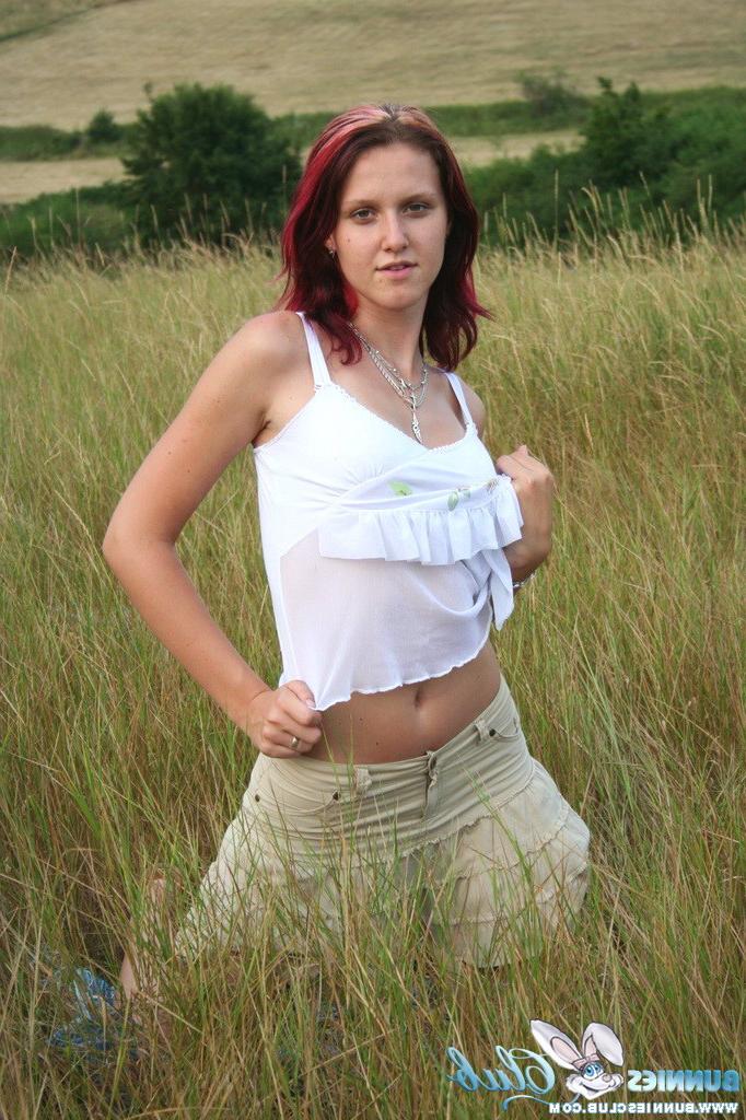 20P Cute redhead girl in the grass