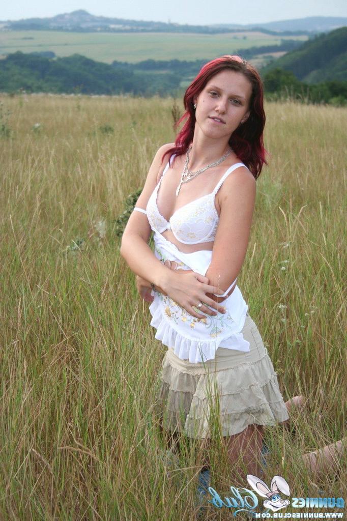 20P Cute redhead girl in the grass