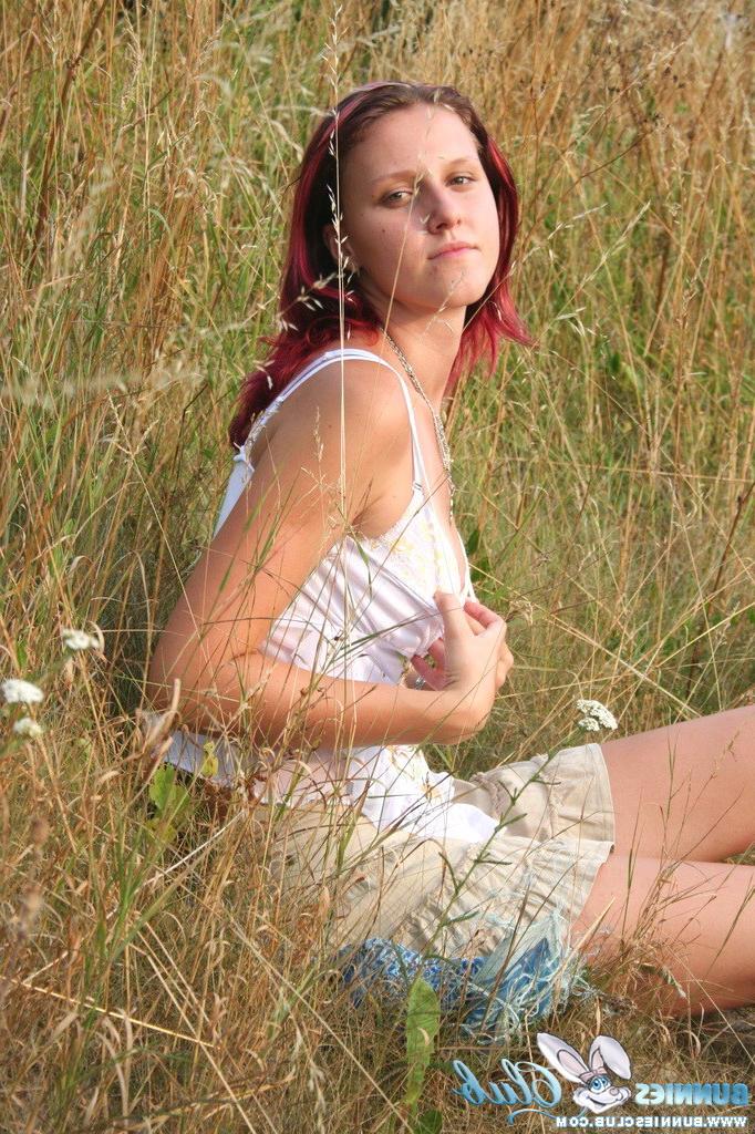 20P Cute redhead girl in the grass