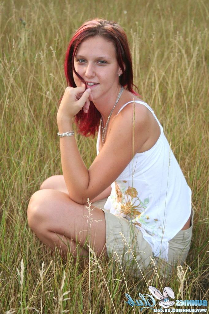 20P Cute redhead girl in the grass