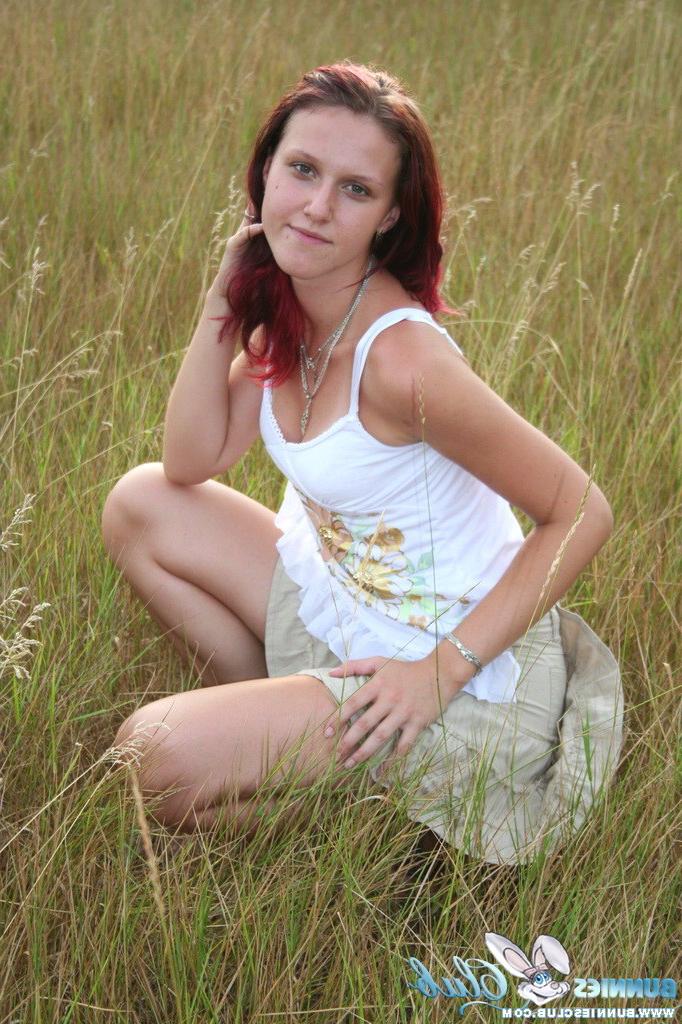 20P Cute redhead girl in the grass