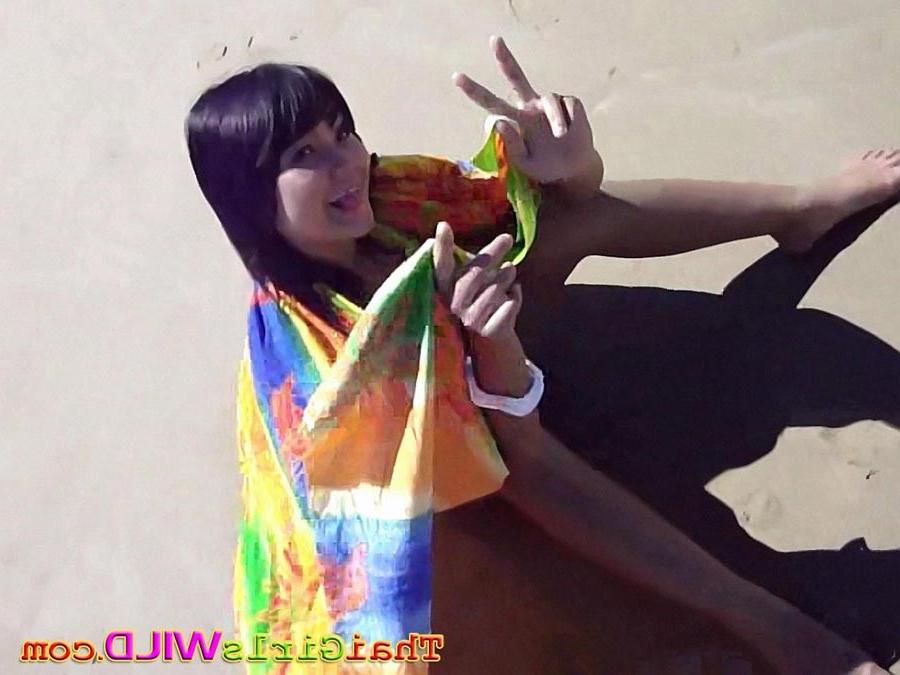 16P Hot teen Thai babe Febe flashes her perky tits at the beach