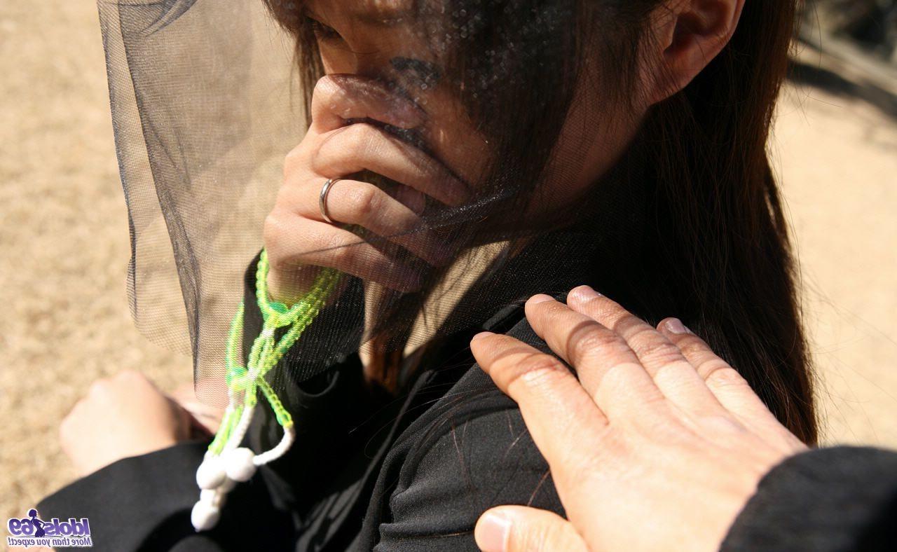 16P Asian widow mourns husband by a picture