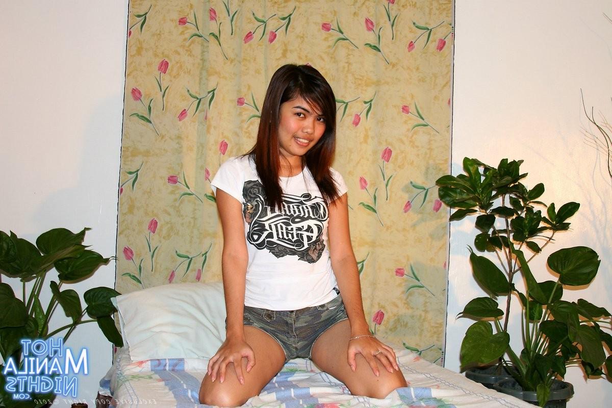 15P Young filipina spreads her bald pussy close on camera