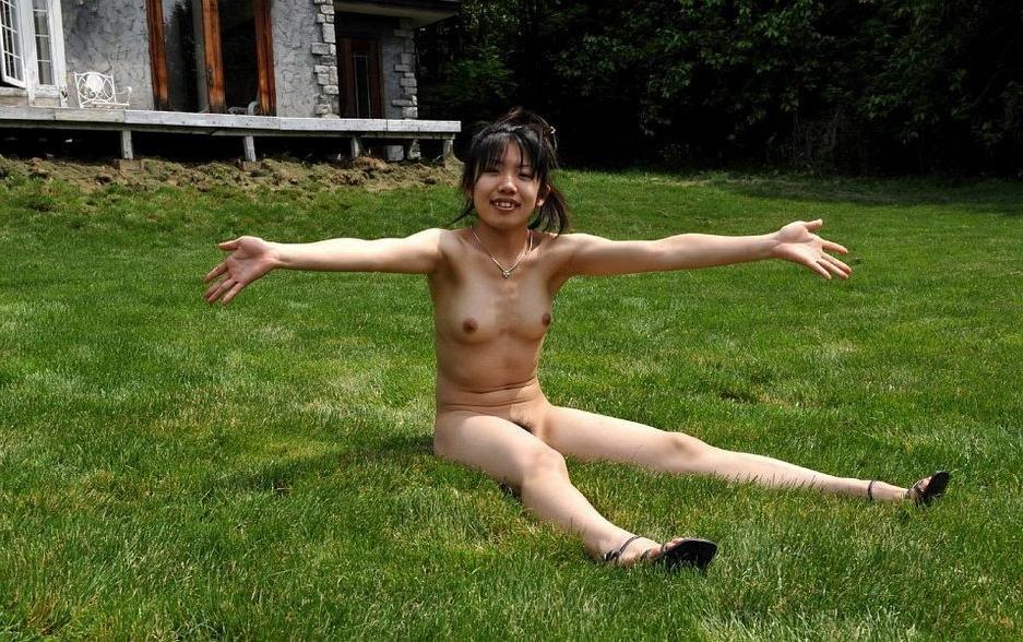 15P Petite asian teen Youzn poses nude outdoors