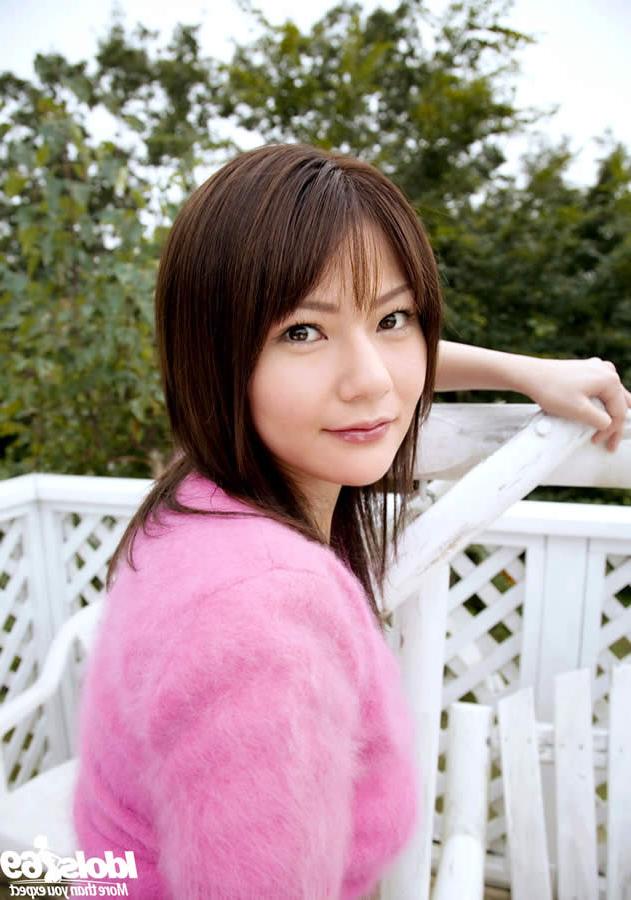 15P Slender japanese girl posing in her garden
