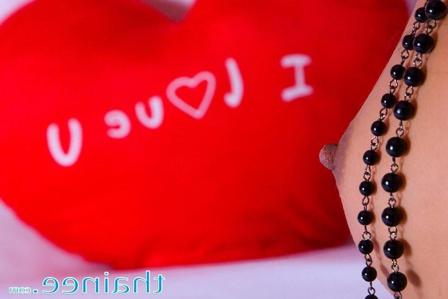 15P Tiny Thai babe Thainee looking sexy as she strips