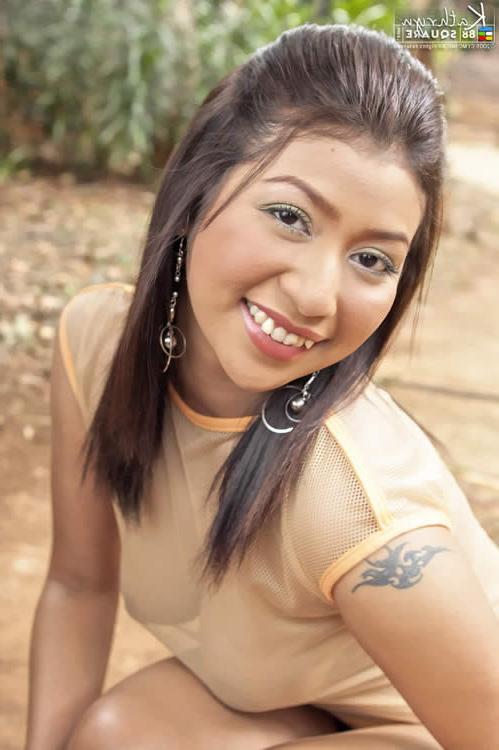 15P Thai girl posing with a soccer ball