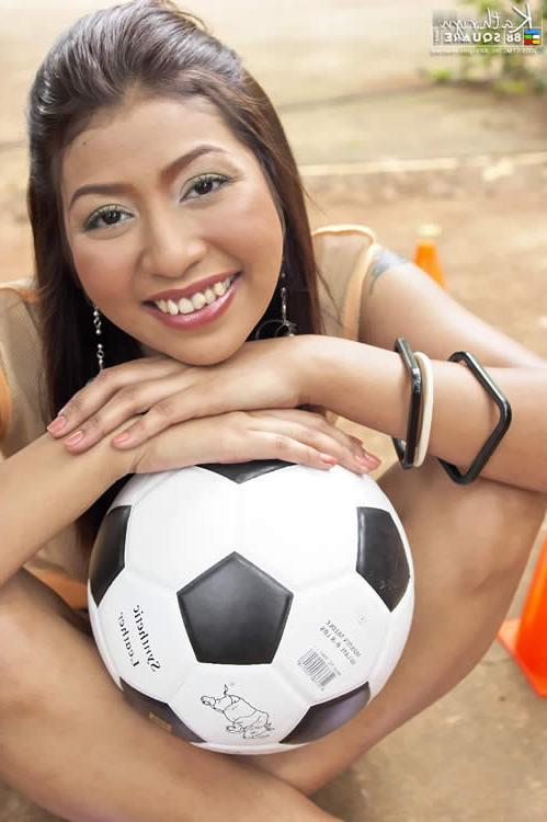 15P Thai girl posing with a soccer ball