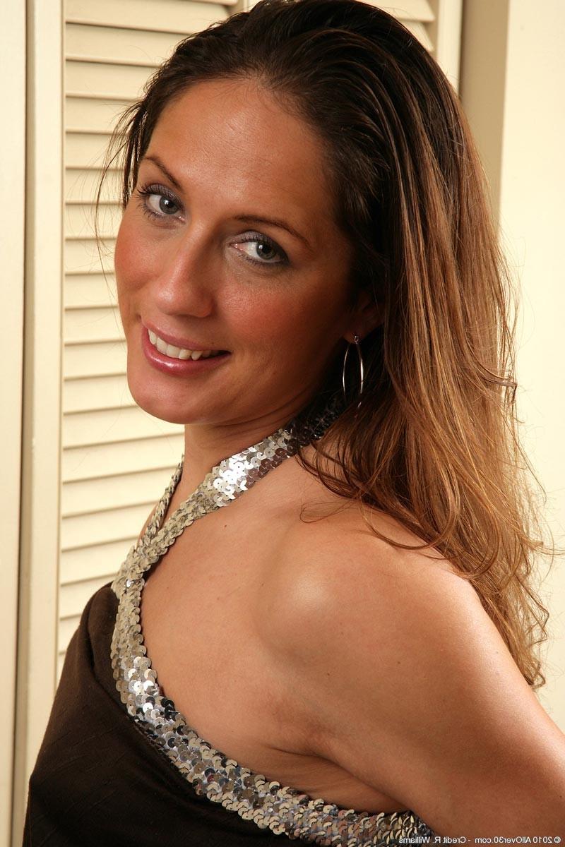 15P Horny milf with perky tits getting naked