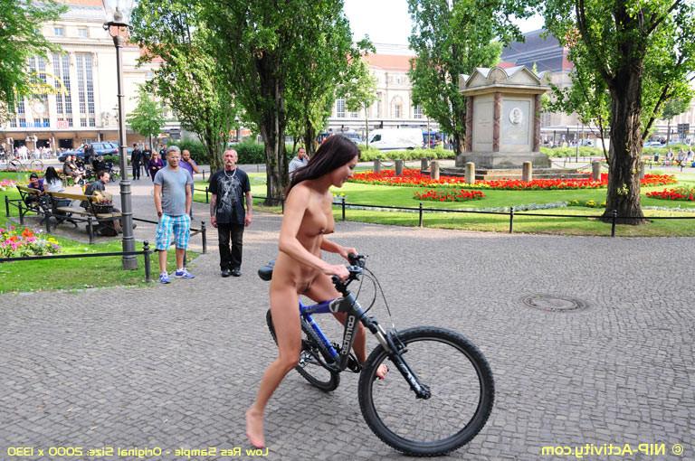 15P Naked bicycling girl