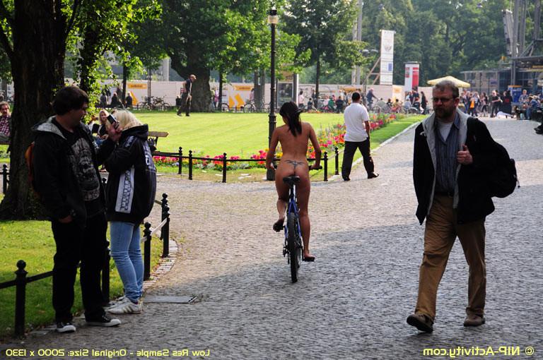 15P Naked bicycling girl