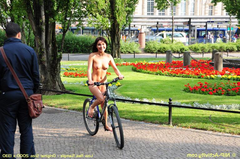 15P Naked bicycling girl
