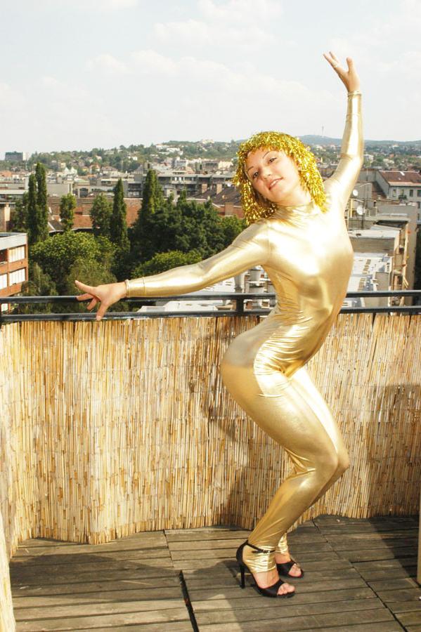 15P Flexible teen in shiny gold catsuit