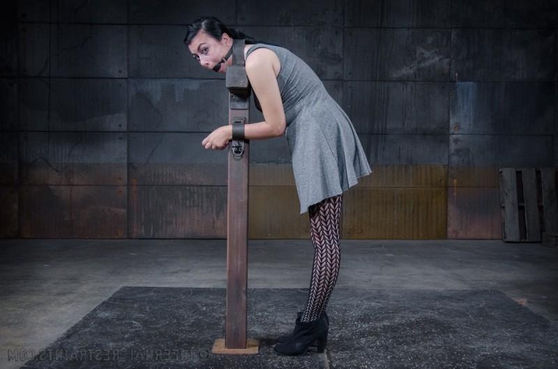 14P Olivia Fawn is strap bound to wooden polie made to orgasm