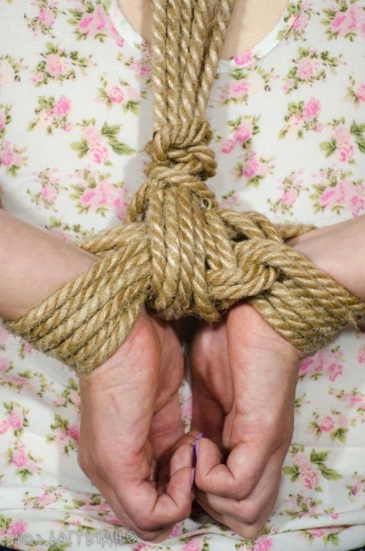 12P Delirious Hunter flexible blonde is bound in rope with tits exposed