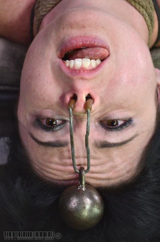 15P Siouxsie Q is bound in a dungeon with clamps on her pussy and spanked