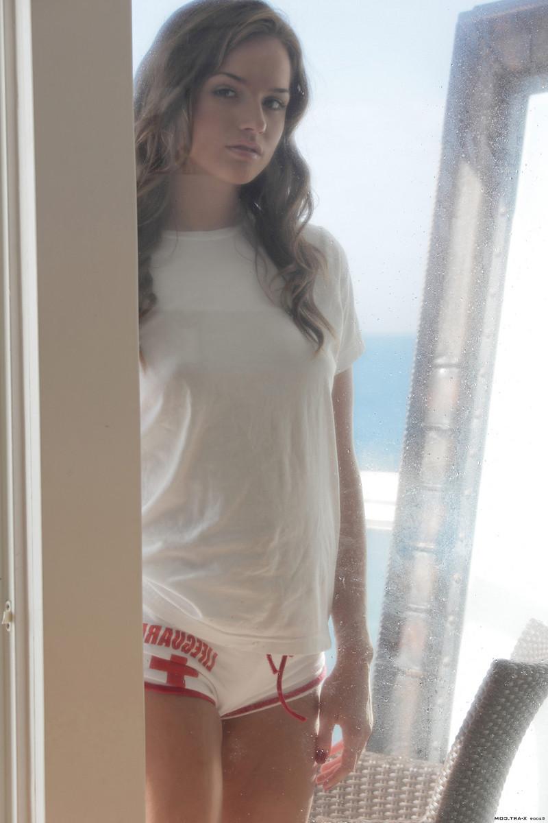 15P Petite brunette babe Tori stripping on patio