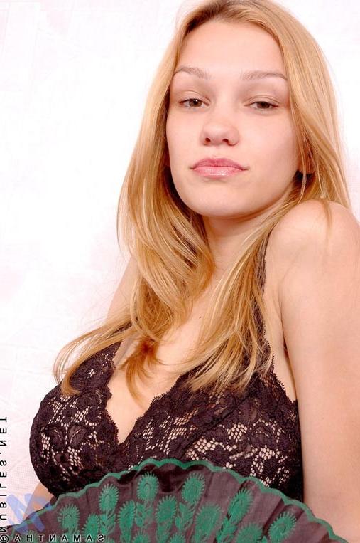 10P Nice petite teen with really huge tits smiles and laughs naked outside