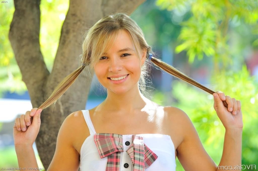 16P Blonde babe with hot perky tits showing her pink pussy outdoors