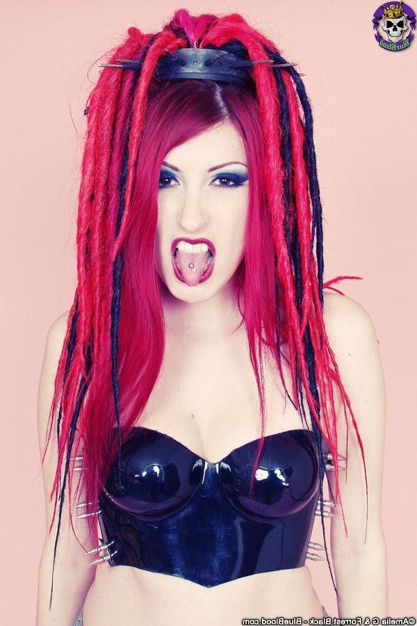 15P Redhaired goth babe babe in a latex top and boots