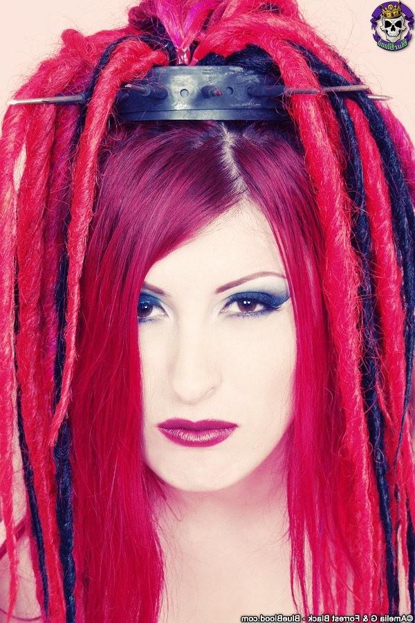 15P Redhaired goth babe babe in a latex top and boots