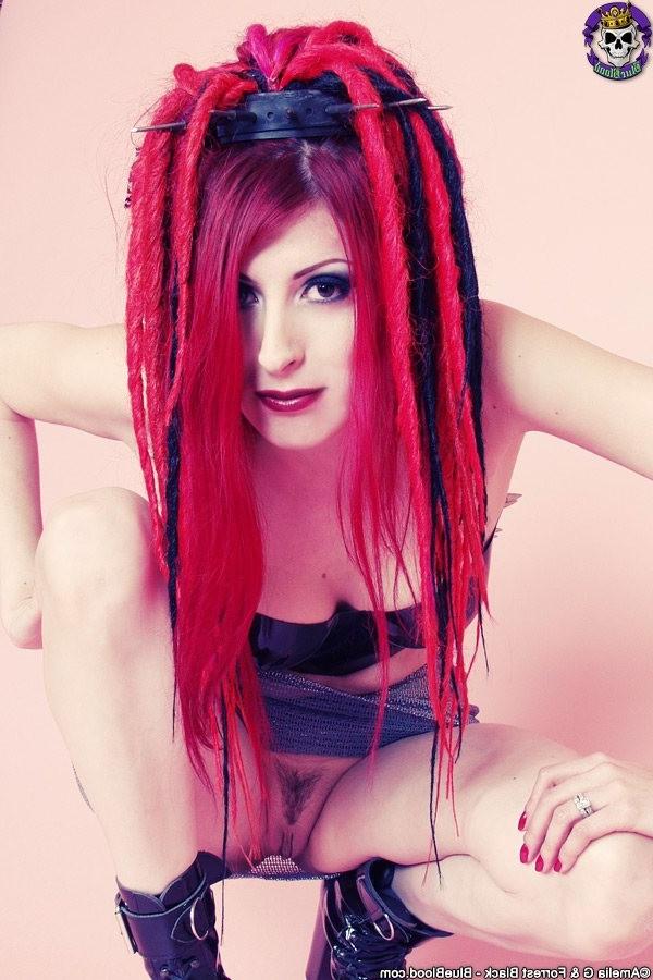 15P Redhaired goth babe babe in a latex top and boots