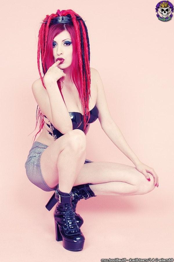 15P Redhaired goth babe babe in a latex top and boots