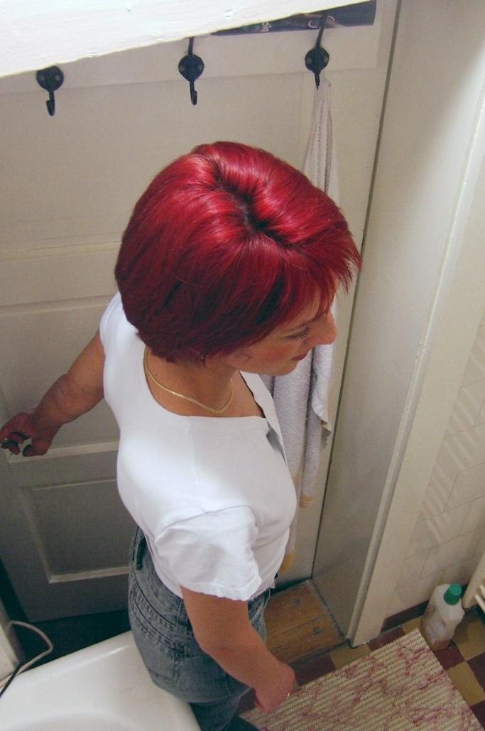 16P Voyeur shots of sexy redhead caught peeing on hidden toilet cam